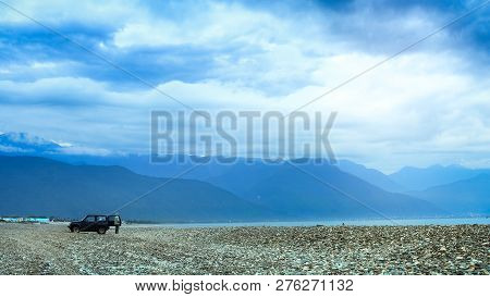 Taiwan, Hualien - May 2013: A Man Gets Off His Car And Enjoy The Amazing Taiwanese Beach. There Are 