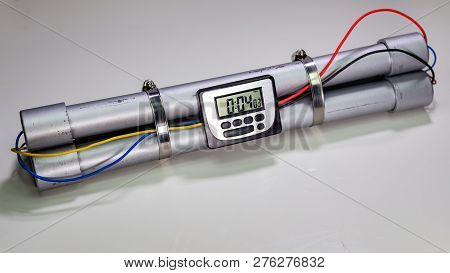 Pipe Bomb With An Clock Timer To Trigger Detonation On White Background