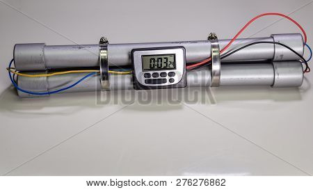Pipe Bomb With An Clock Timer To Trigger Detonation On White Background