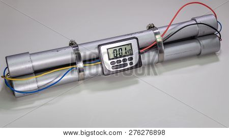 Pipe Bomb With An Clock Timer To Trigger Detonation On White Background