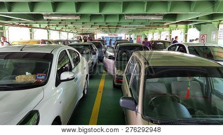 Penang - Malaysia / September 2016: Passengers And Their Cars Using Public Ferry To Move Between Pen