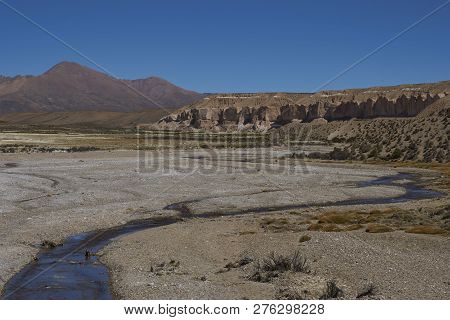 Eroded Cliffs Along The Wide Valley Of A Tributary Of The River Lauca High On The Altiplano Of North