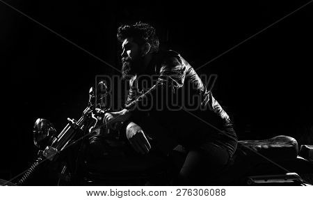 Masculinity Concept. Macho, Brutal Biker In Leather Jacket Riding Motorcycle At Night Time, Copy Spa