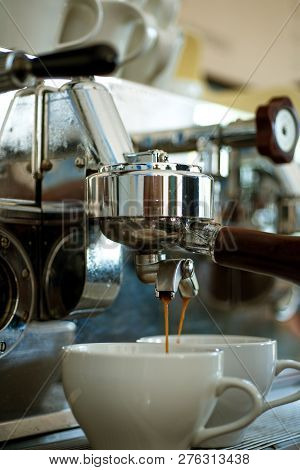 Delivering Maximum Flavour Extraction In Every Cup. Coffee Being Brewed In Cafe. Coffee Cups. Making