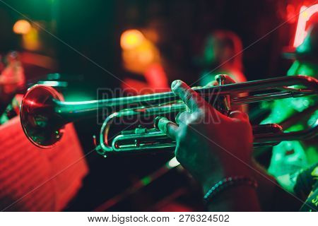 Close Up Of Saxophone Player Hands Playing Alto Sax Musical Instrument Over Piano Background , Close