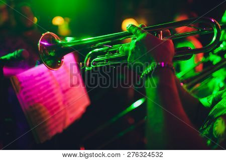 Close Up Of Saxophone Player Hands Playing Alto Sax Musical Instrument Over Piano Background , Close