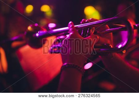 Close Up Of Saxophone Player Hands Playing Alto Sax Musical Instrument Over Piano Background , Close