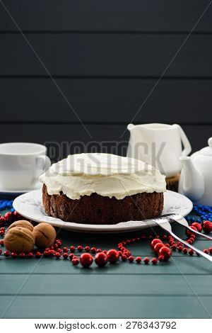 Traditional Fruit Cake Minimalist Style. Tasty Chocolate Cake With Cream Cheese And White Teaware On