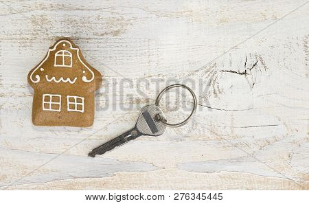 A House From Gingerbrad With The House Key. Buy A House Concept