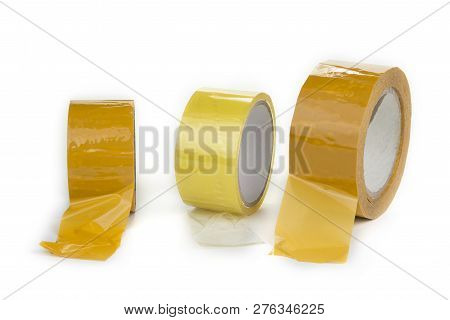 Three Rolls Of Scotch Tape On A White