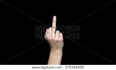 Hand Sign Showing Middle Finger In Rude Way Meaning Fuck Off, Isolated On Black Background. Human Ha