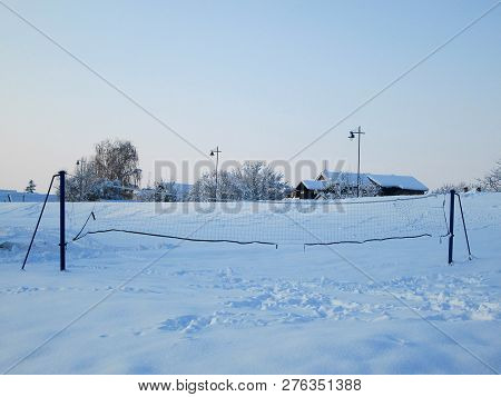 Snow And Ice Covered Volleyball Court In The Winter Freezing Day. River Danube Environment, Futog Se