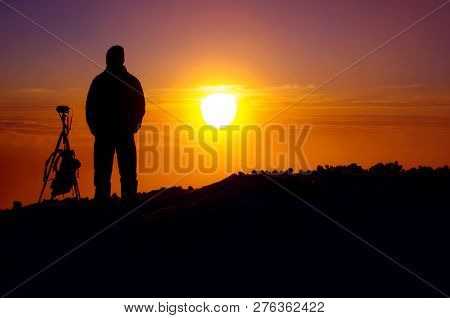 Photographer Waiting For The Sunrise In The Mountains