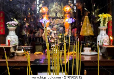 Burning Incense In The Budhism Temple In Cambodia