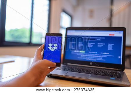 Chiang Mai, Thailand - June 03,2018: Man Holding Huawei With Dropbox On Screen. Dropbox Is A Service