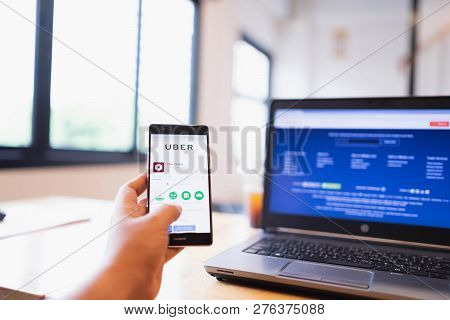 Chiang Mai, Thailand - June 03,2018: Man Holding Huawei With Uber Apps. Uber Is Smartphone App Trans