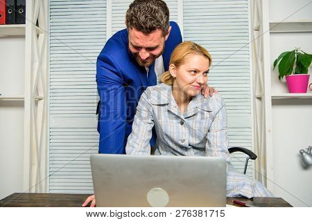 Create Greater Safety And Trust. Sexual Harassment At Work. Man And Woman Colleagues Flirt In Office