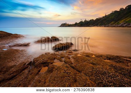 Sea And Boulders Foreground With Long Exposure Shot When Sunset. Shot At Yanui Beach, Phuket, Thaila
