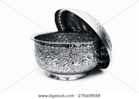 Close Up Of White Or Silver Colored Shiny Container Isolated On White.
