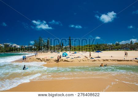 CALOUNDRA, AUS - DEC 28 2018: Hot sunny summer day at Moffat Beach, Calundra, Queensland, Australia