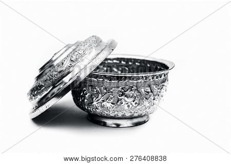 Close Up Of White Or Silver Colored Shiny Container Isolated On White.