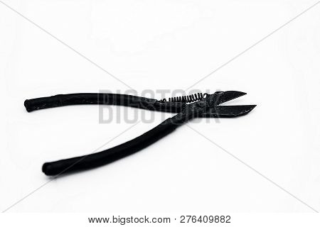 Close Up Of Pilers Isolated On White With A Blue Colored Handle.