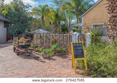 Clanwilliam, South Africa, August 28, 2018: A Wagon With Succulents For Sale In Front Of A Guest Hou