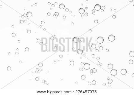 Many Small Light Water Drops Isolated Over A White Background.