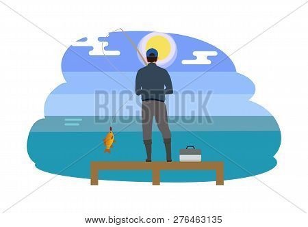 Man Standing On Wooden Pier With Tackle Box. Person Wearing Waders High Wellingtons. Fisherman Catch