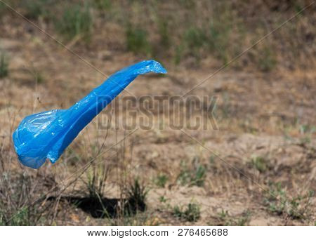 Blue Polyethylene Bag For Garbage Fly On A Summer Sunny Day, Copy Spce