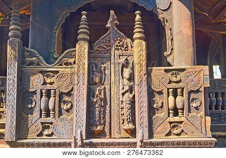 Decorative Wooden Gate With Carved Nats (spirits), Floral Patterns, Small Peacocks And Myhical Anima