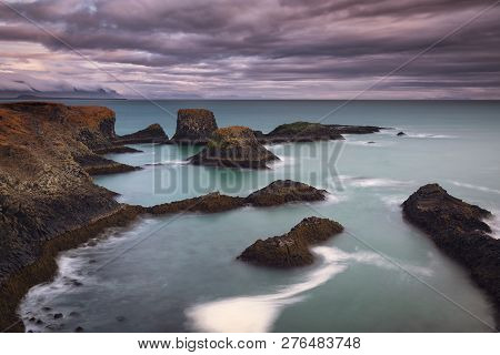 Volcanic Cliffs And Basalt Rocks In Arnarstapi, Iceland