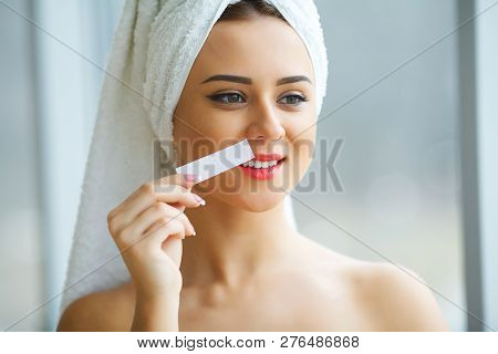 Hair Removal Wax. Young Woman Reciving Facial Epilation