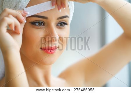 Hair Removal Wax. Young Woman Reciving Facial Epilation