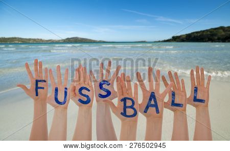 Many Hands Building Fussball Means Football, Beach And Ocean