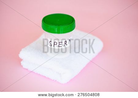 Health. Close Up Sperm Analysis. Concept Of Bank Sperm. Infertility Bank With Sperm On Pink Backgrou