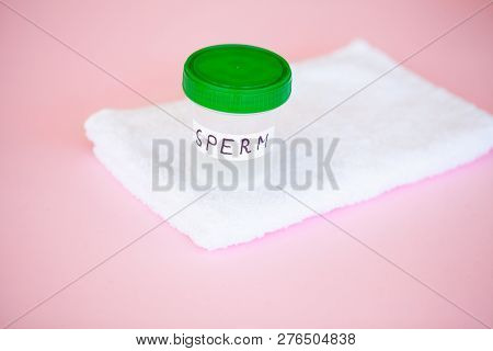 Health. Close Up Sperm Analysis. Concept Of Bank Sperm. Infertility Bank With Sperm On Pink Backgrou