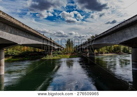 Interstate 5 Bridges Across The Santiam River In Oregon With A Blue Sky With Clouds.