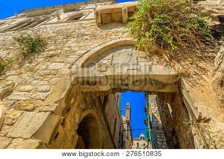 Scenic View At Old City Gate In Hvar Town, Famous Ancient Town In Croatia, Mediterranean.