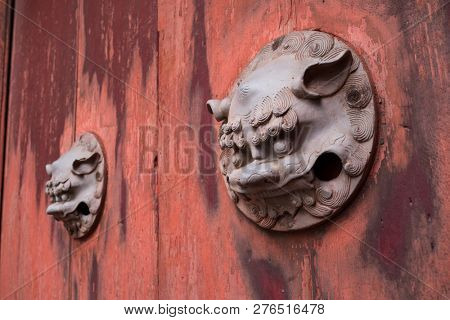 Nagasaki, Japan - October 22, 2018: Traditional lion decoration at the Ryugumon Gate of the Sofukuji Temple  
