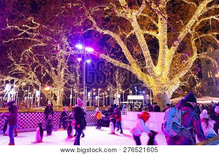 Vienna, Austria - Dec 18, 2018: People Skating At The Ice Rink Near The Rathaus Palace Near To Famou