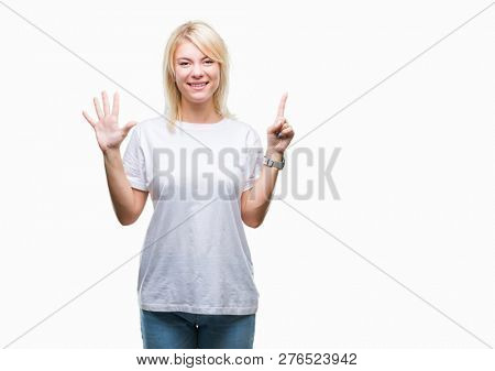 Young beautiful blonde woman wearing white t-shirt over isolated background showing and pointing up with fingers number six while smiling confident and happy.