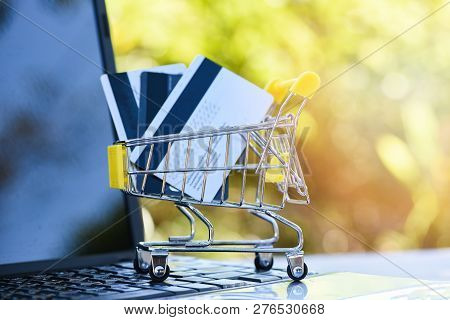 Credit Card And Using Laptop Easy Payment Online Shopping Concept Shopping Cart With Credit And Debi