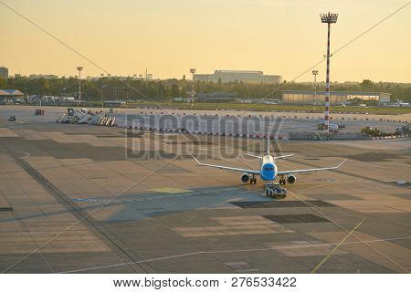 DUSSELDORF, GERMANY - CIRCA OCTOBER, 2018: KLM Cityhopper aircraft on pushback at Dusseldorf Airport.