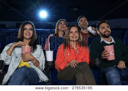 Young People Watching Movie In Cinema Theatre