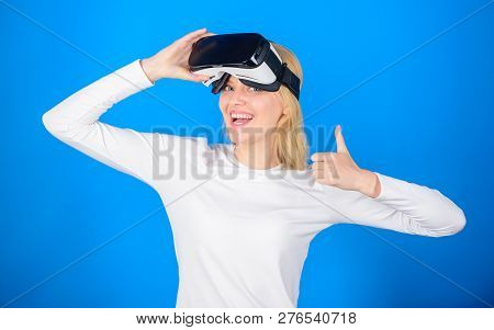 Amazed Young Woman Touching The Air During The Vr Experience. Woman Watching Virtual Reality Vision.