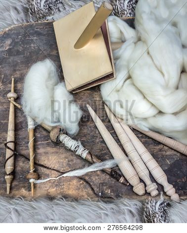 Primitive Spindles And White Sheep's Wool
