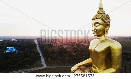 Aerial View Of Big Golden Buddha Statue At Sun Rise, Countryside Of Thailand