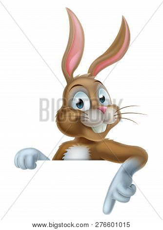Cartoon Easter Bunny Rabbit Character Pointing At An Easter Message