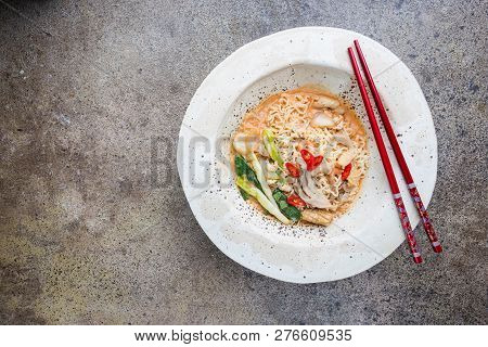 Japanese Ramen Noodle With Chicken, Shiitake Mushroms And Egg In White Bowl, Top View